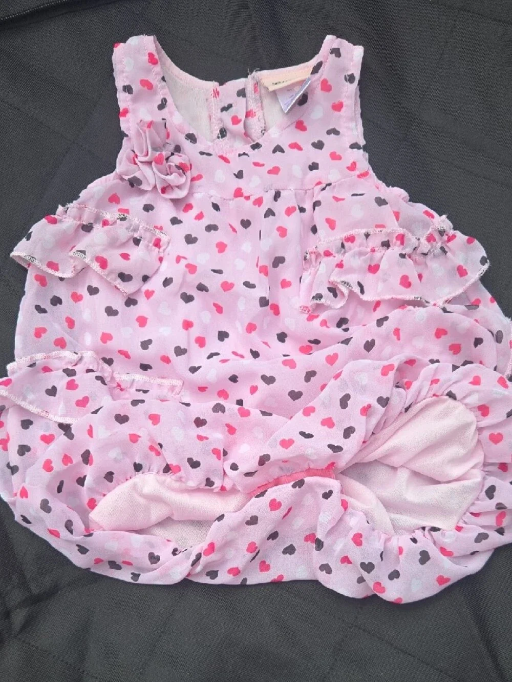 Lot of 7 pieces of girls clothes, tops, dresses, and bottoms.